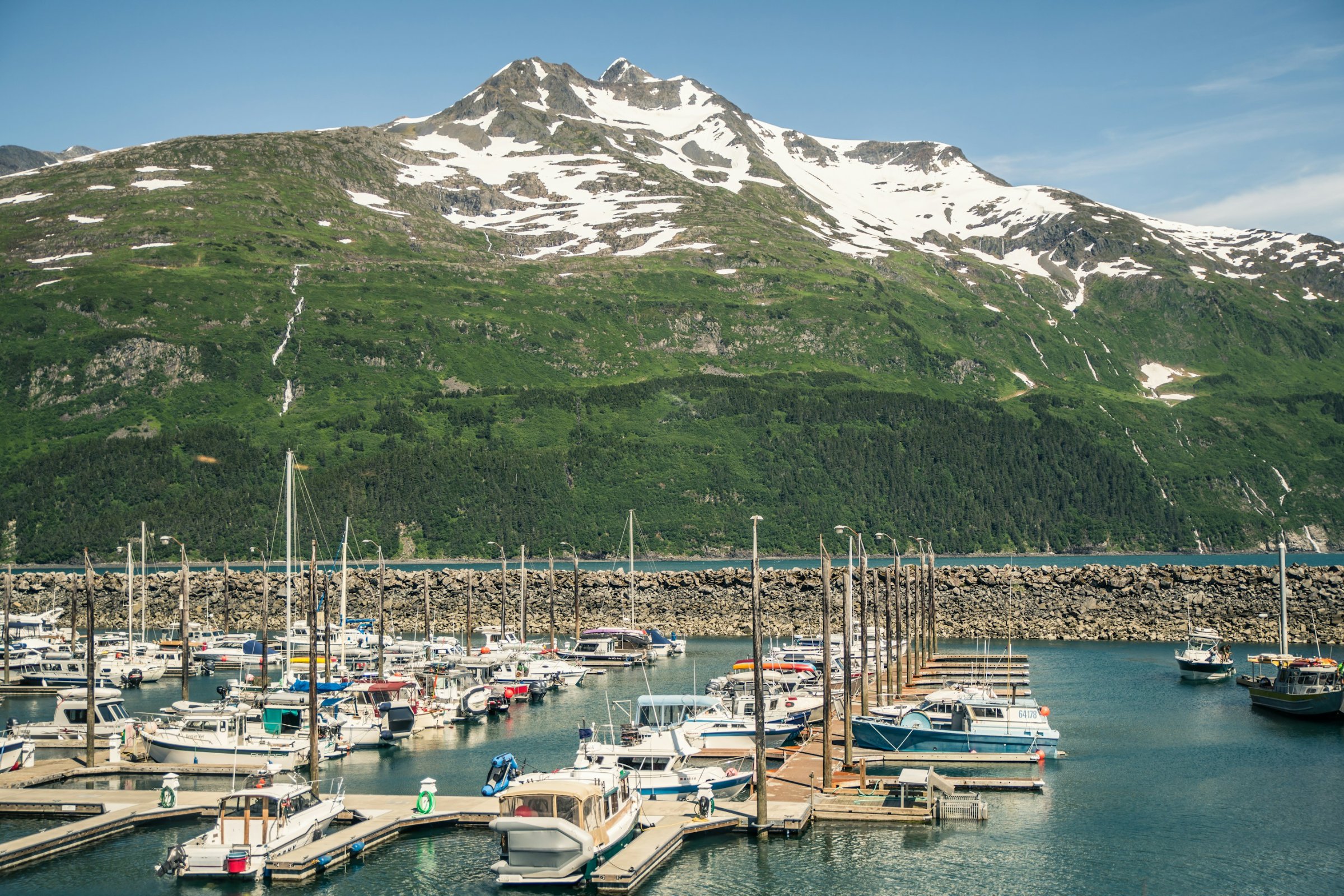 Marina below a snow-capped mountain in Seward, Alaska