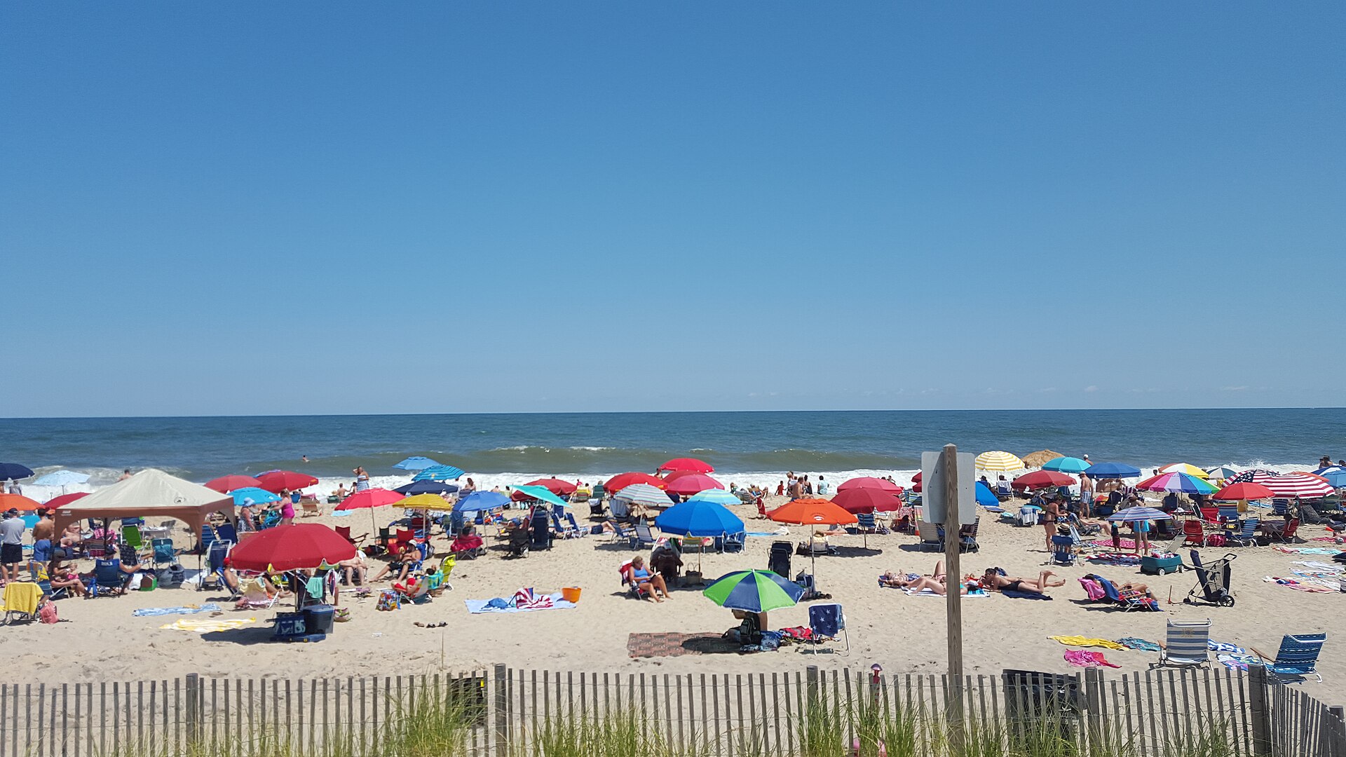 Beachgoers on the shore at Bethany Beach, Delaware