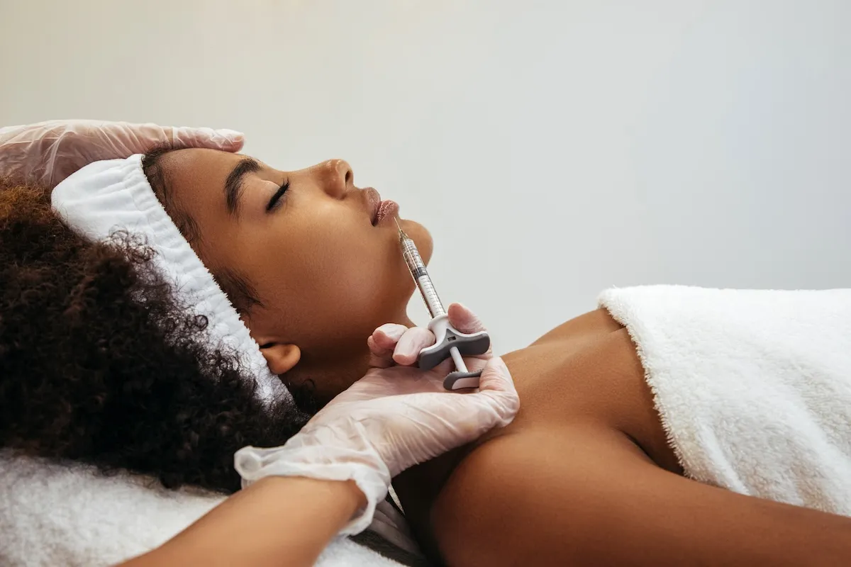 woman  receiving a  lip  filler service  from newday medspa in jacksonville 	
