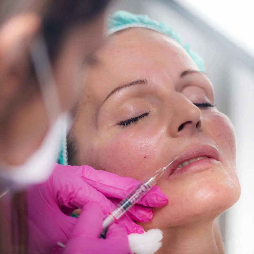 Close-up of a woman receiving a lip injection from new day med spa for lip filler in jacksonville florida
