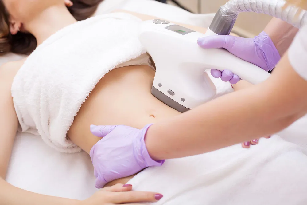 Woman receiving body contouring treatment on her abdomen by new day med spa in florida jacksonville
