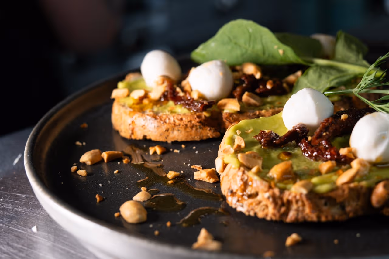 A plate of food with a leaf on top.