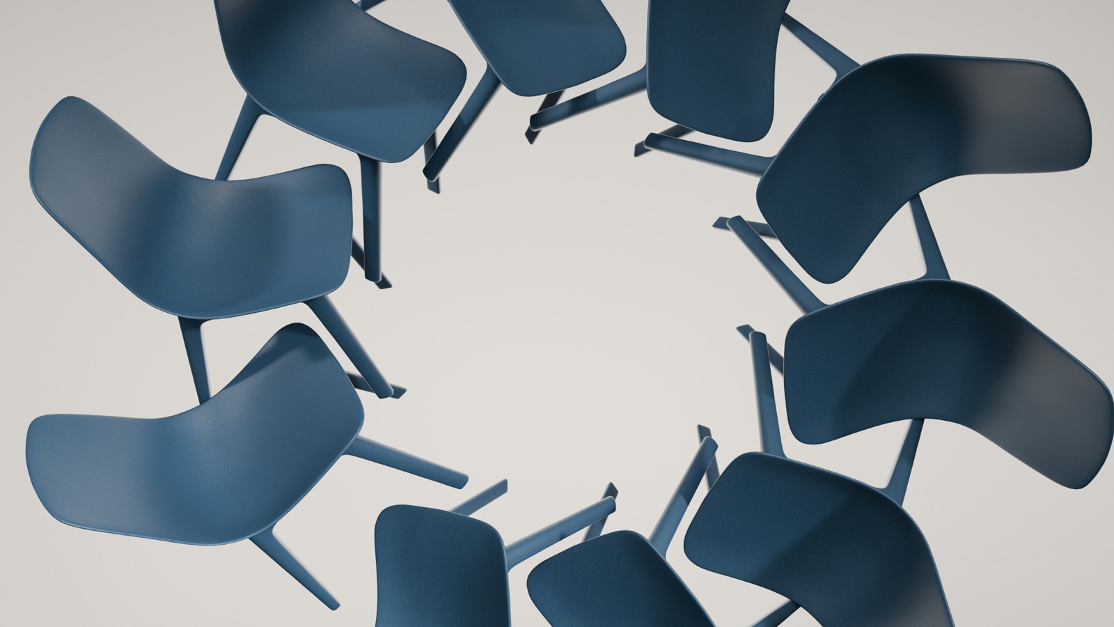 Modern chairs arranged in an empty circle, photographed from above