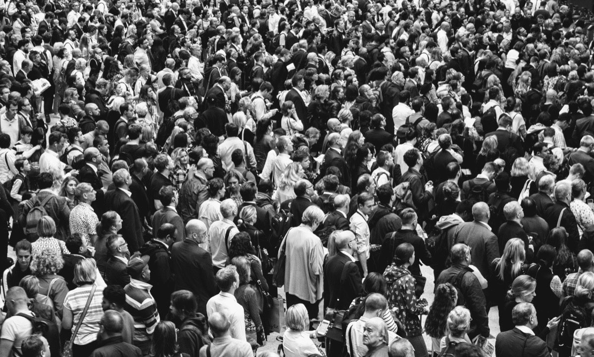 A dense crowd of people photographed from directly above