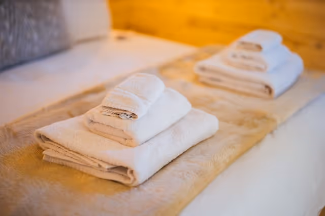 Folded towel set an a clean fresh bed