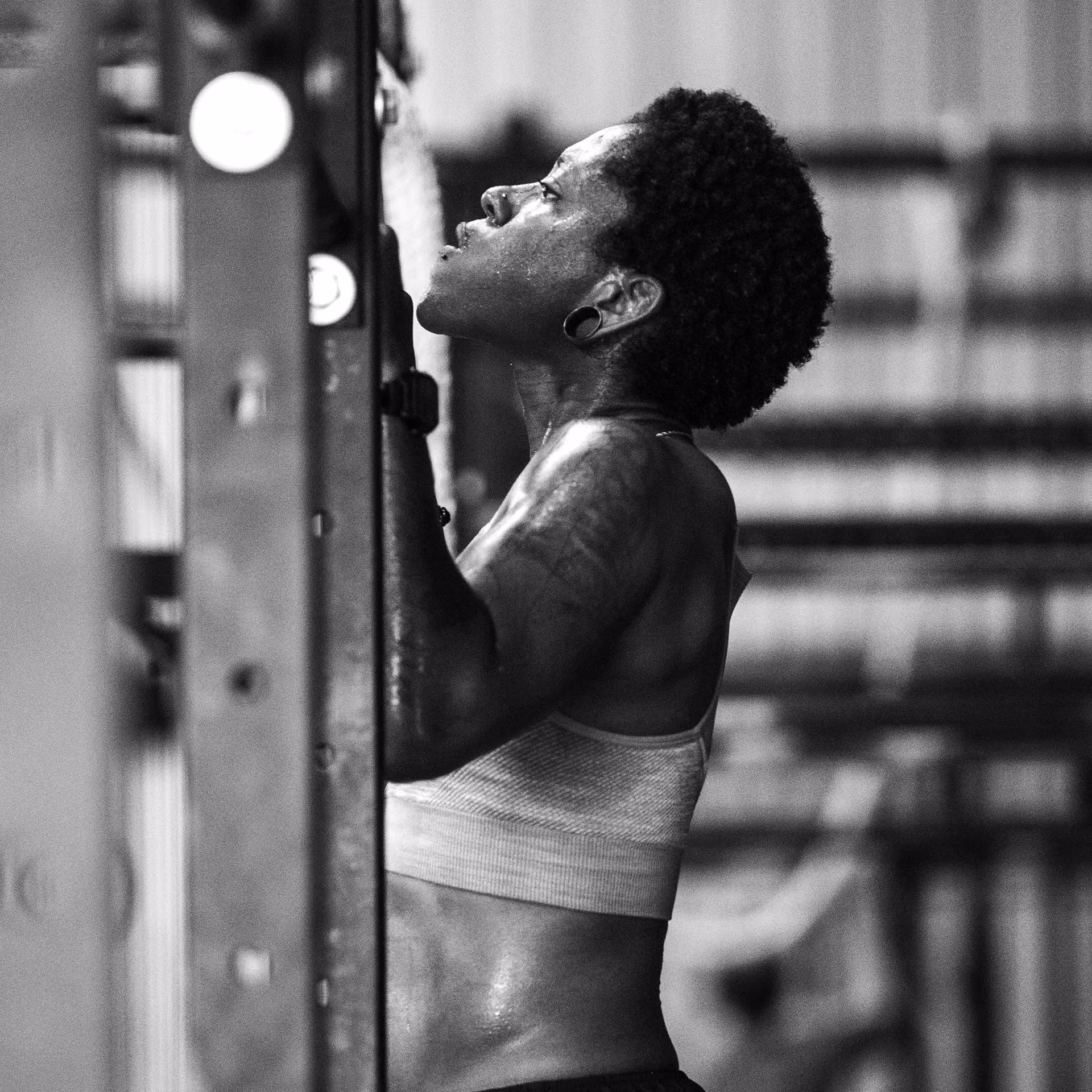CrossFit coach guiding athlete during personal training session in Dallas Texas gym