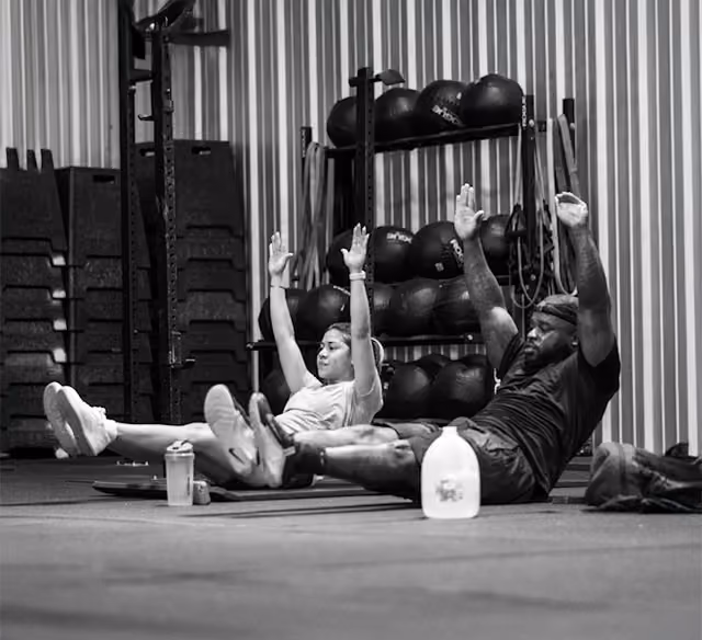 Athlete performing barbell clean at CrossFit Love Field gym near Love Field Airport Dallas