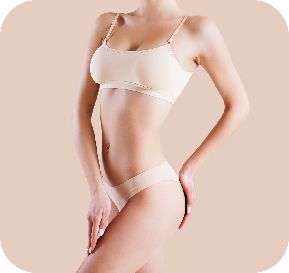 Woman wearing beige underwear posing against a light beige background.