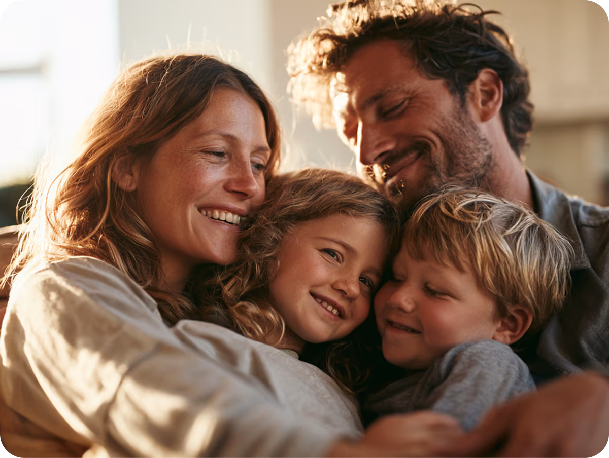Smiling family embracing