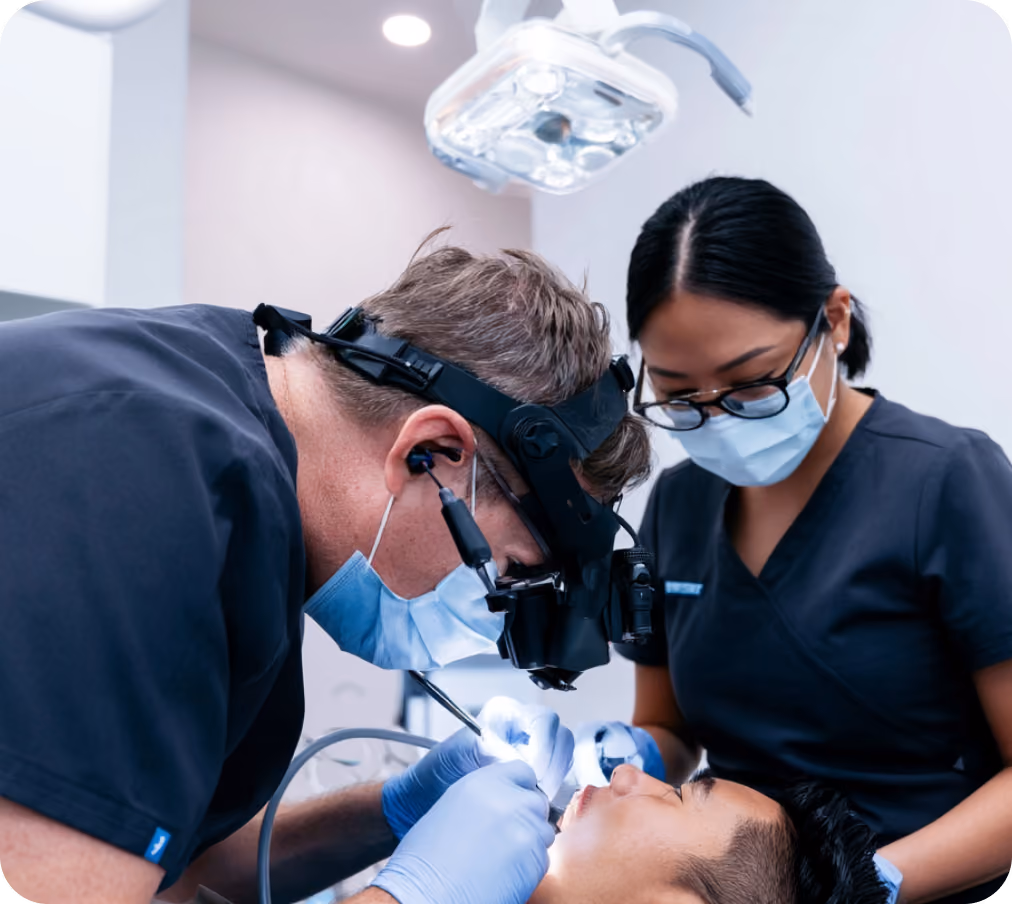 Dental clinic team treating a patient