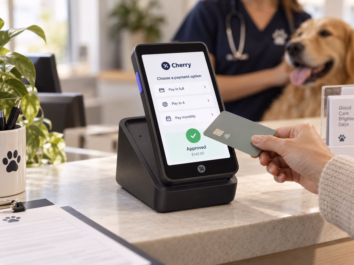 Client tapping a card on the Cherry terminal at a veterinary clinic