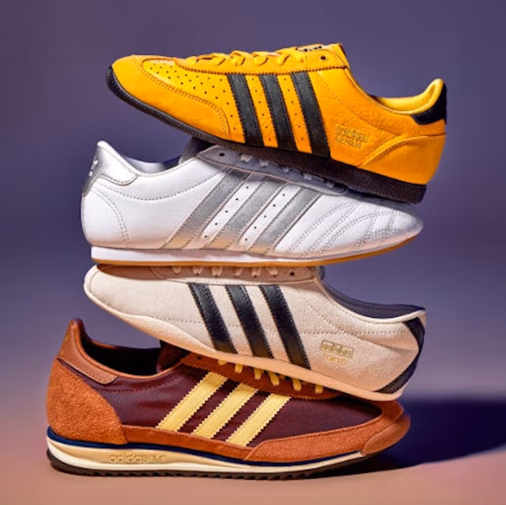 Stack of different colored Adidas low-cut shoes
