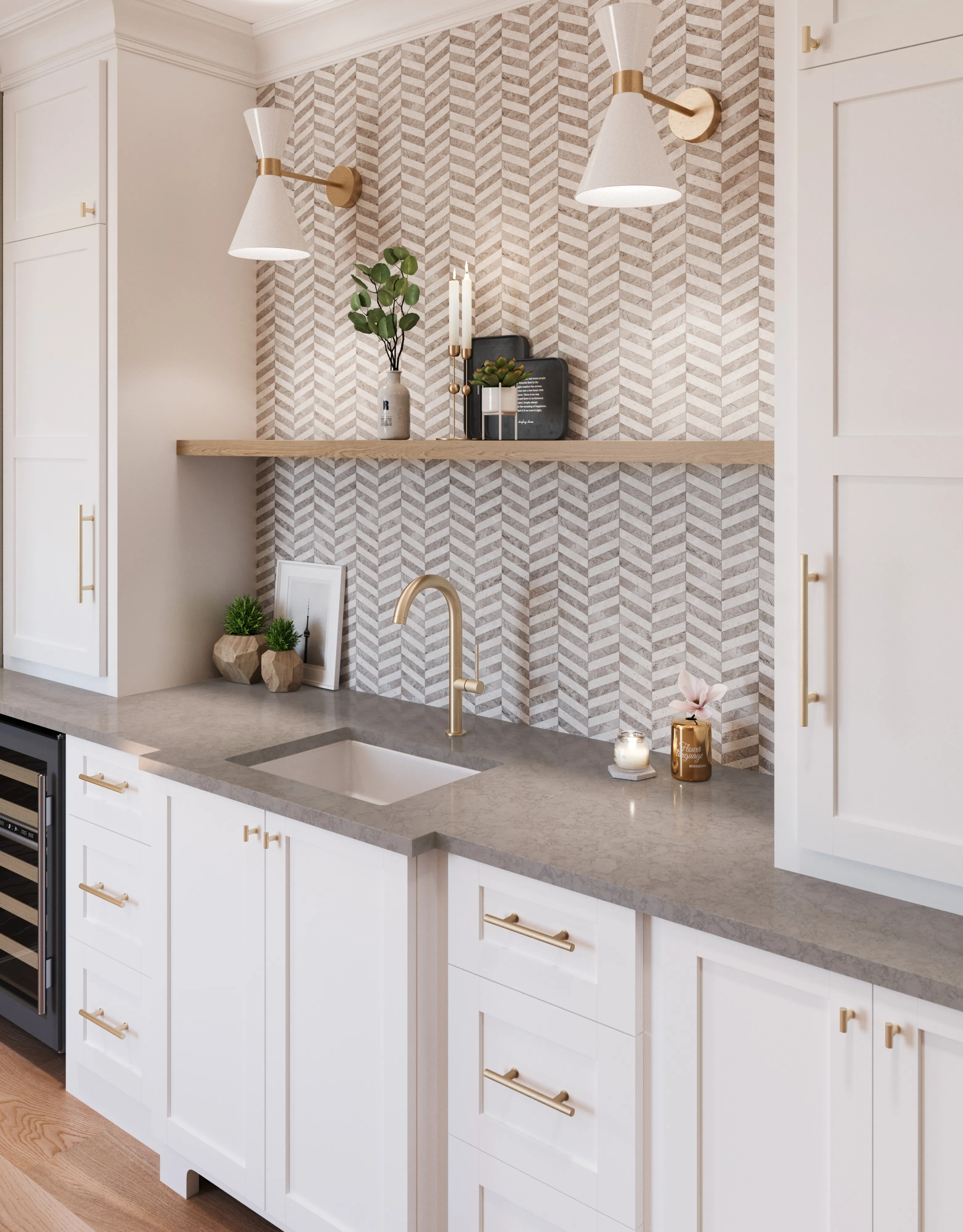 White wet bar with chevron tile backsplash, gold fixtures, and gray countertop