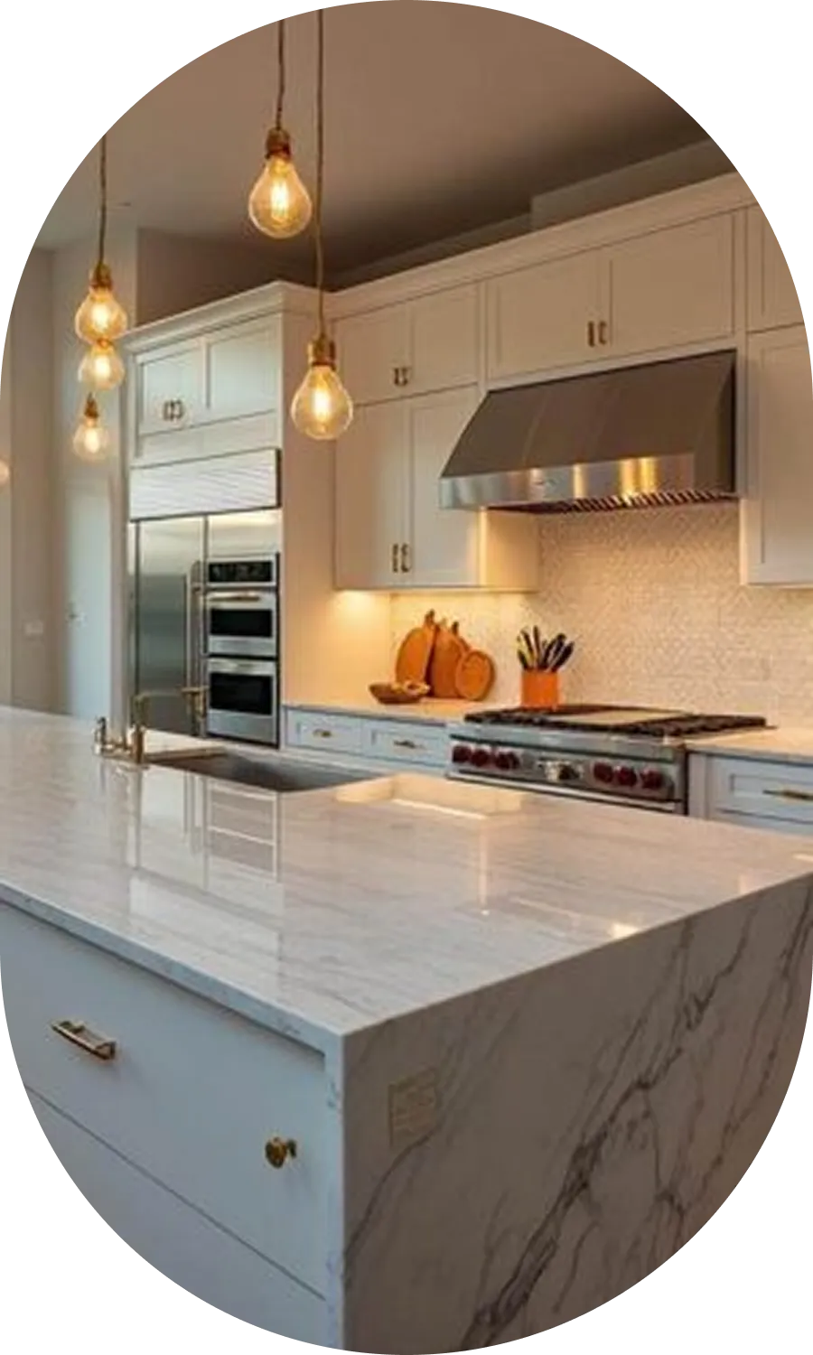 Modern white kitchen with marble waterfall island and pendant lighting