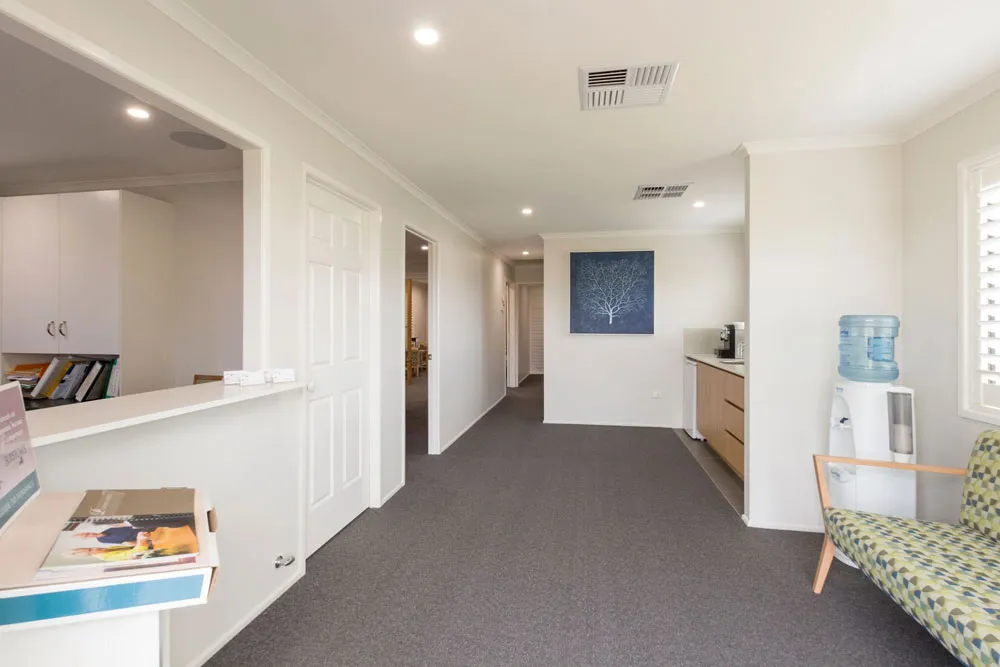 Bright, open-plan interior with kitchen and living area.
