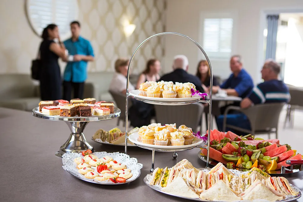 People enjoying food and drinks in a social setting.