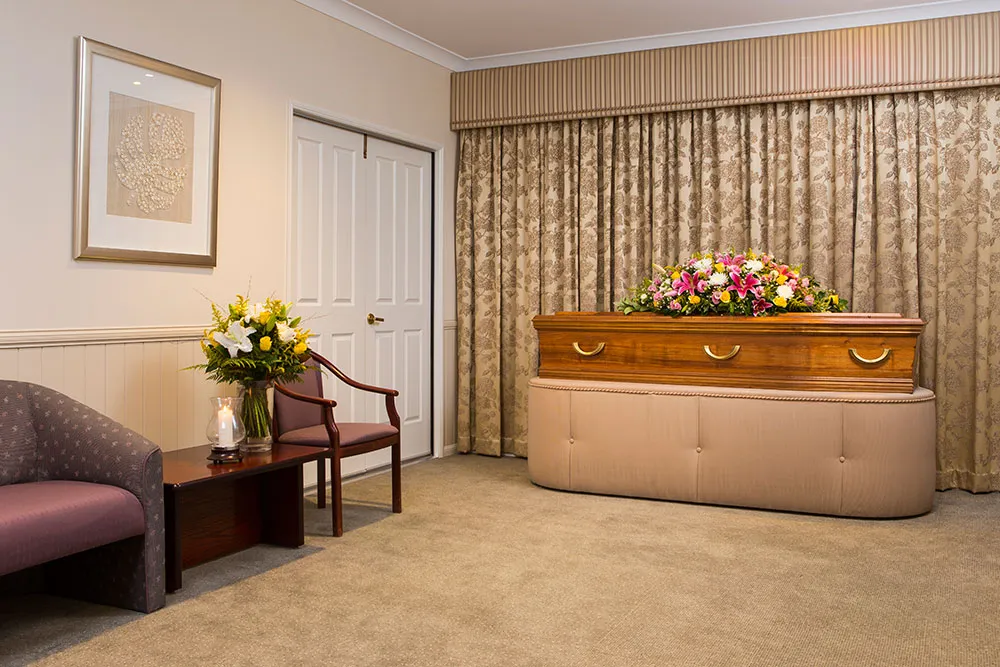 Modern interior viewing room with a sofa and decor.