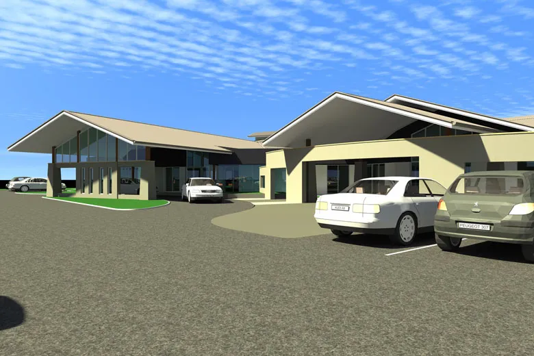 Modern building exterior, with cars in the parking lot.