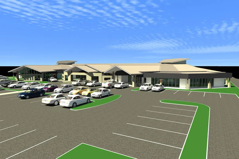 Large parking lot with cars, modern buildings.
