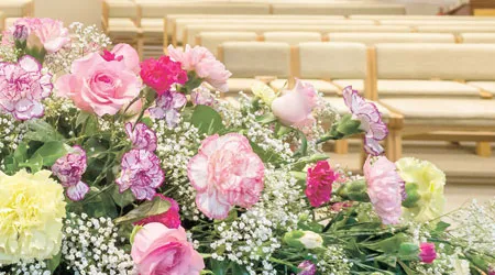 A floral arrangement of pink, white, and purple flowers.