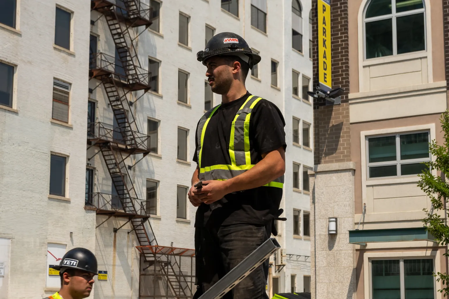 Thor Plumbing & Heating branded hard hat on technician at jobsite
