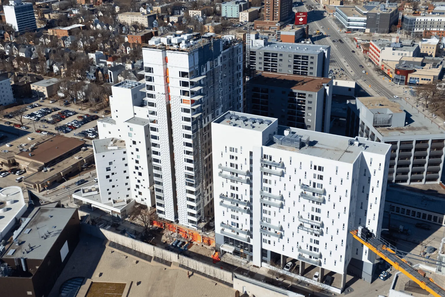 Aerial view of multi-story residential apartment tower under construction in Winnipeg