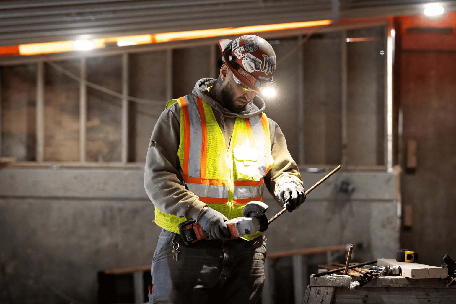 Construction tradesperson working with rebar in underground construction site