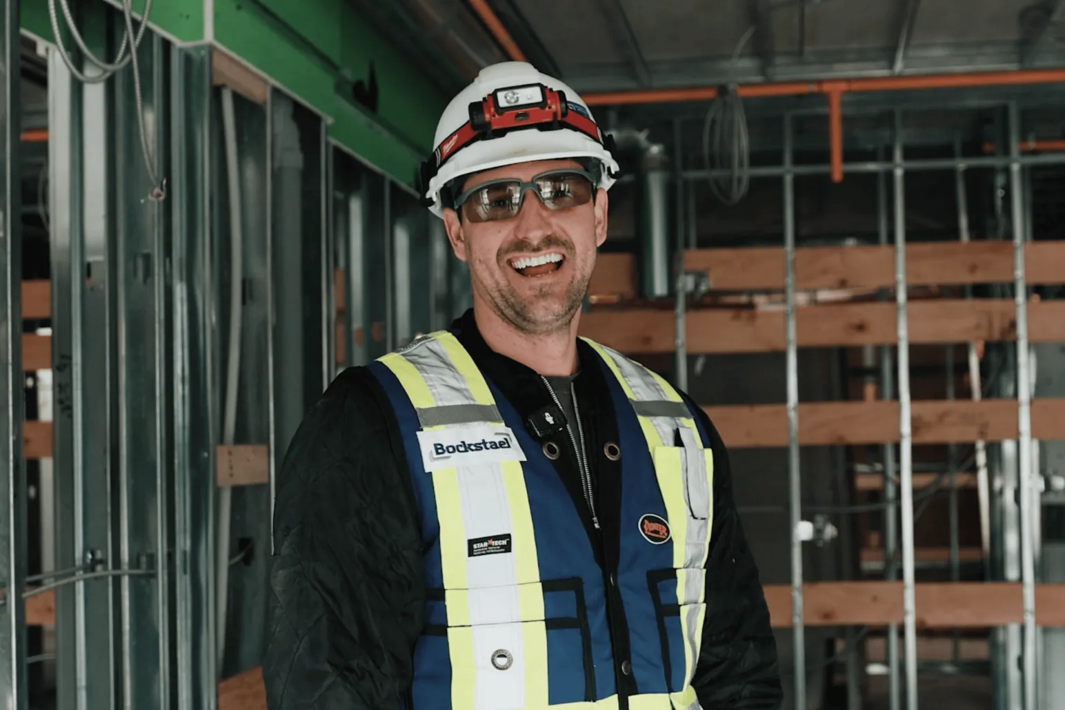 Bockstael Construction superintendent on camera interview warehouse setting