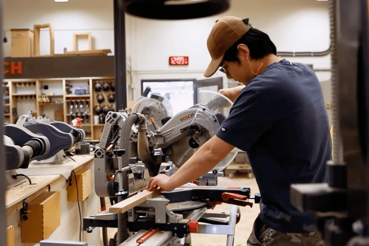 Carpentry student operating precision miter saw during construction trades training at RRC Winnipeg