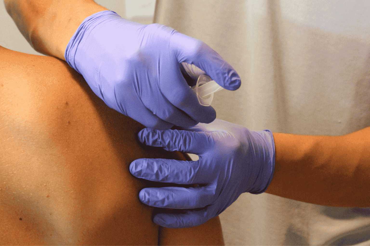 Dr. Bridger Cutler performs Platelet-Rich Plasma (PRP) and ozone injection on an athlete's shoulder to promote natural healing.
