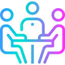 Three people sitting at a table in a matchmaking or meeting setting.