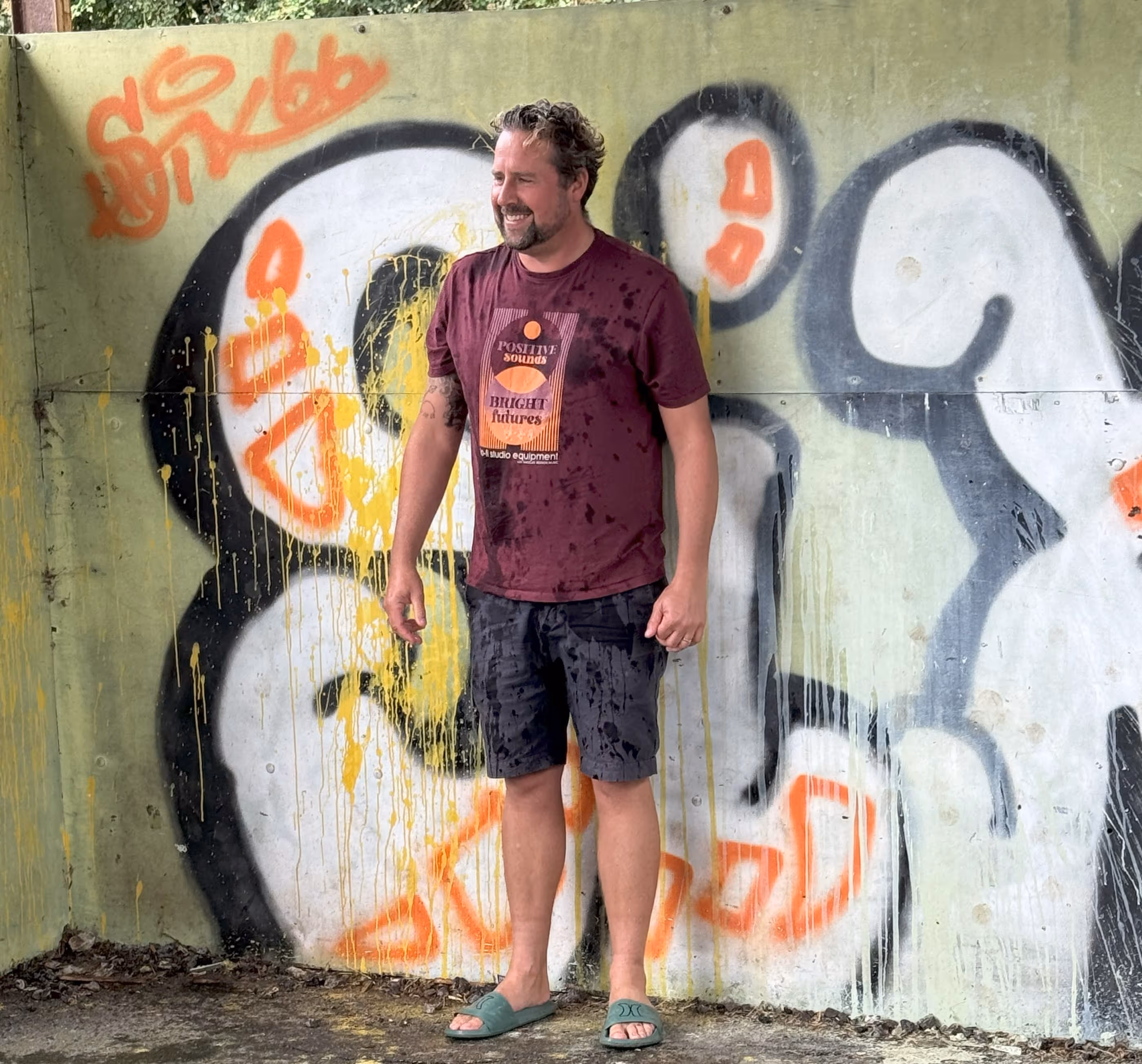 Man stood in front of wall