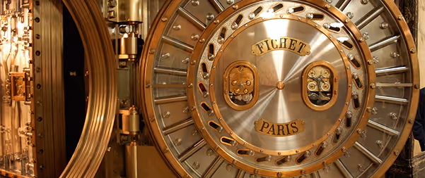 Vintage golden bank vault door with Fichet Paris emblem