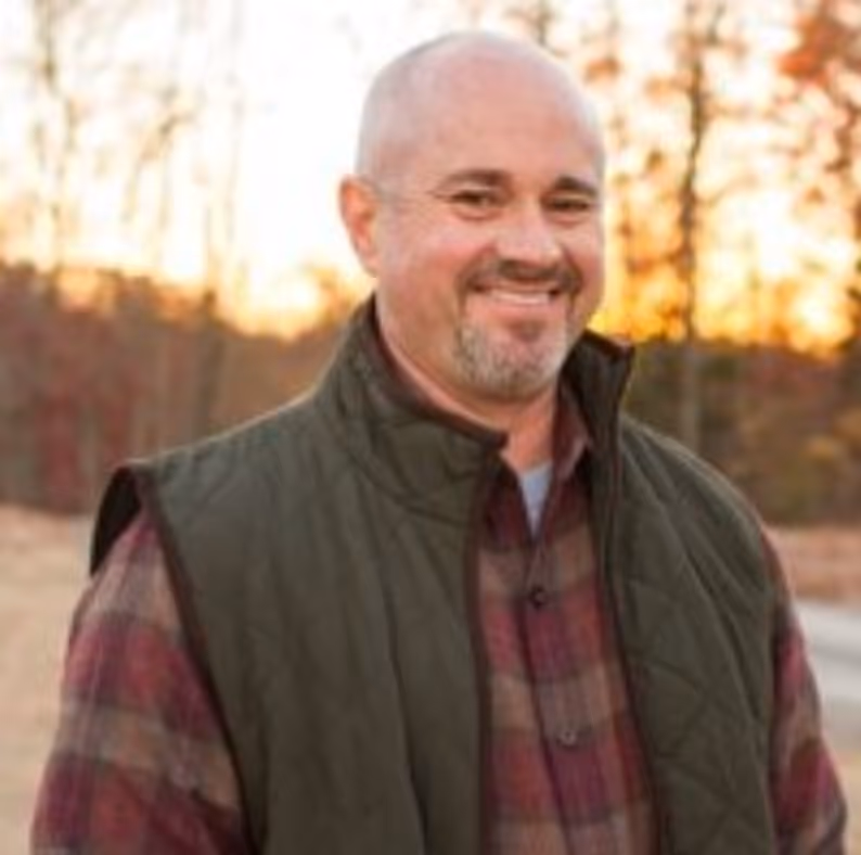 A headshot of Myron Mullins