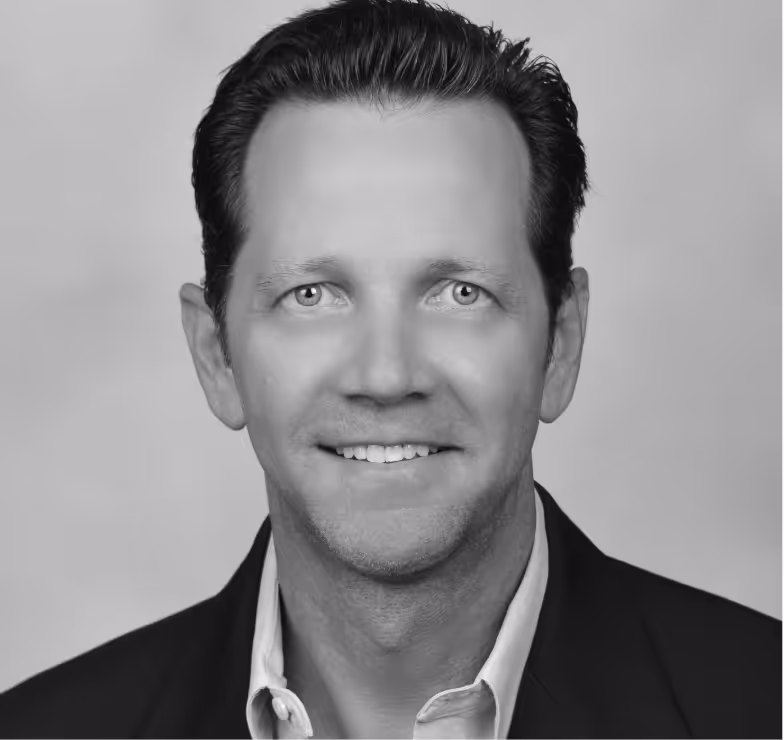 A headshot of Greg Sullivan