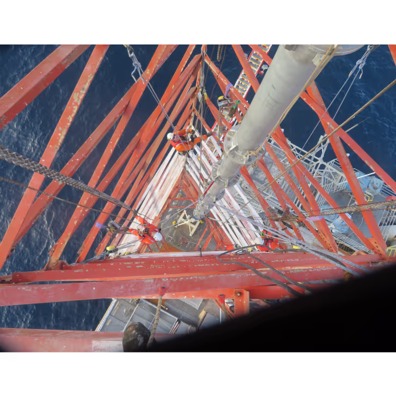 Top view of gin pole installed within flare tower destined for removal, showcasing integral role in dismantling process.