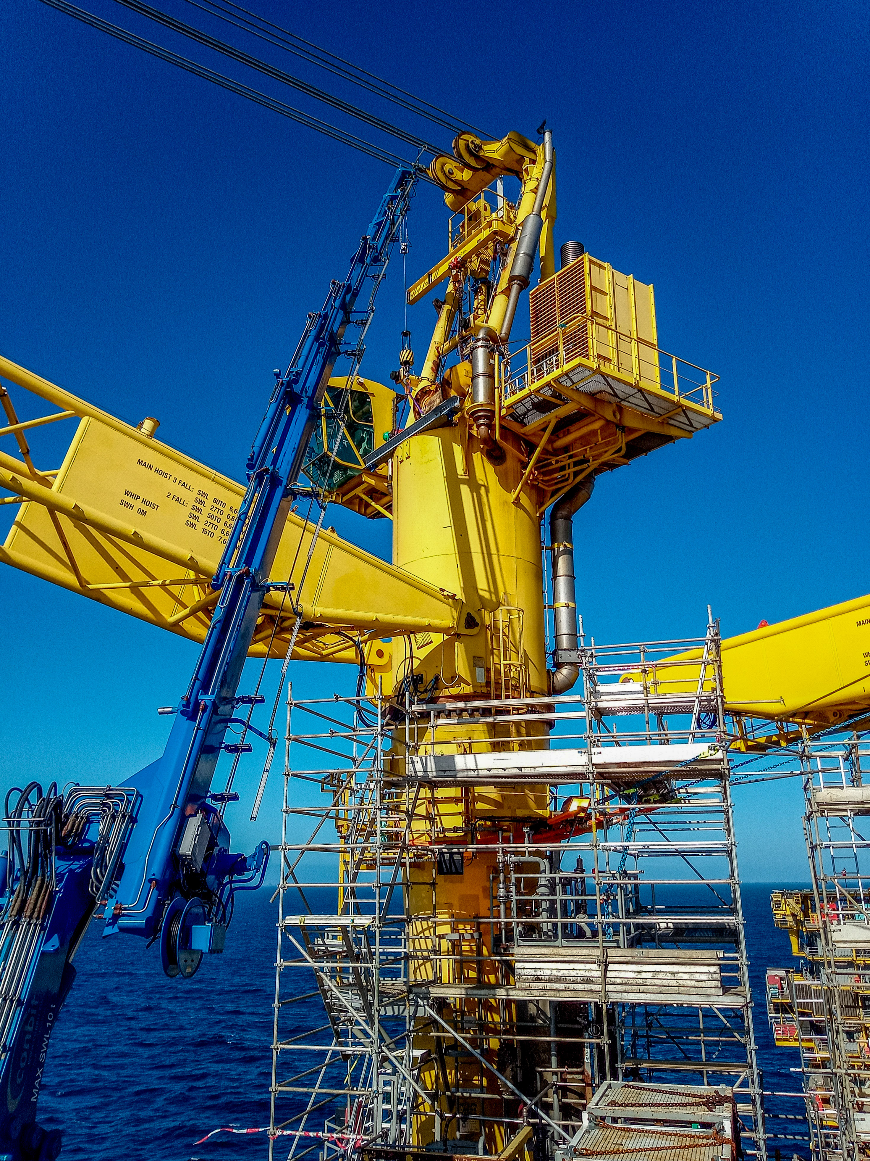 Repair works with temporary crane on offshore crane
