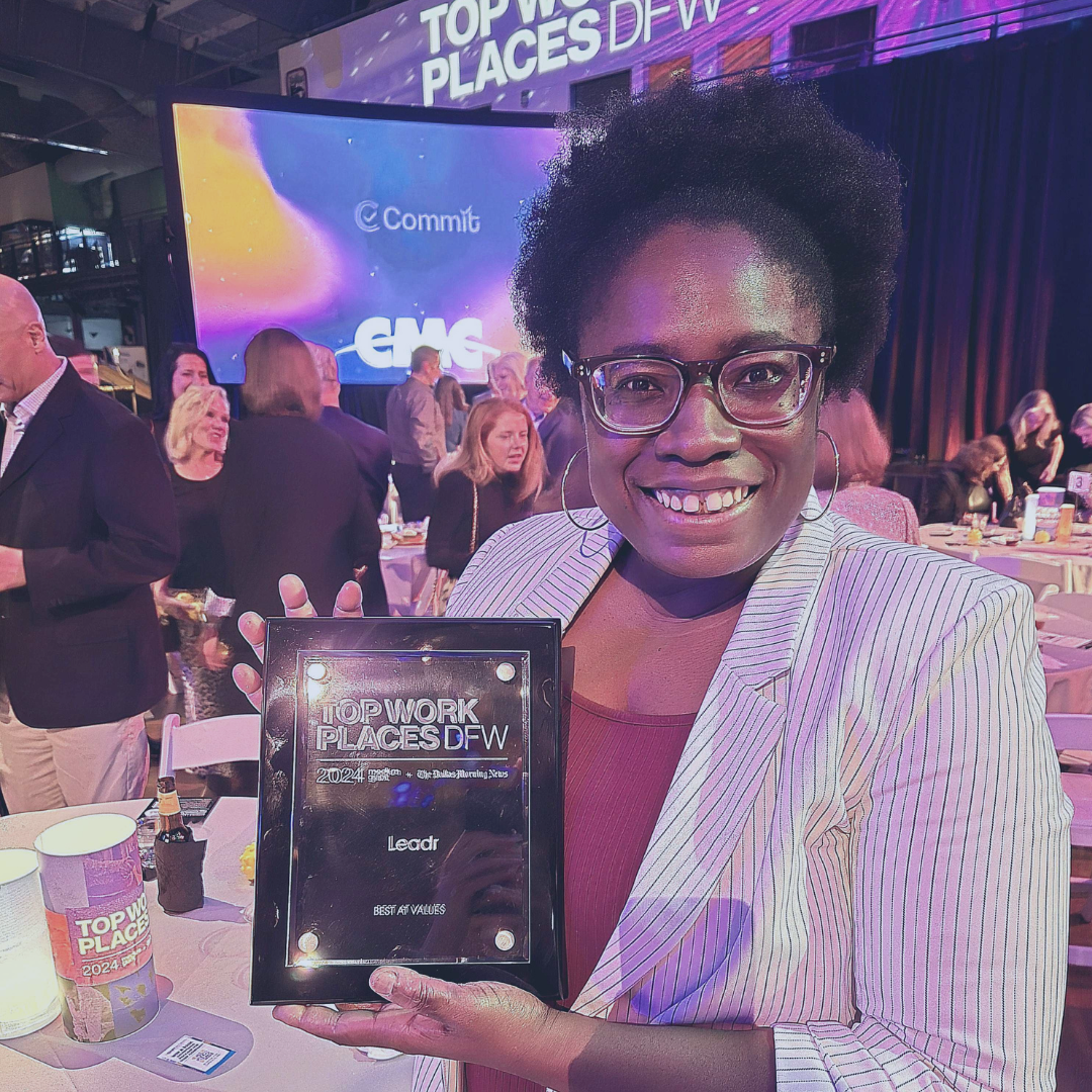 Woman with earned award 2024 Top Places to Work in Dallas by The Dallas Morning News