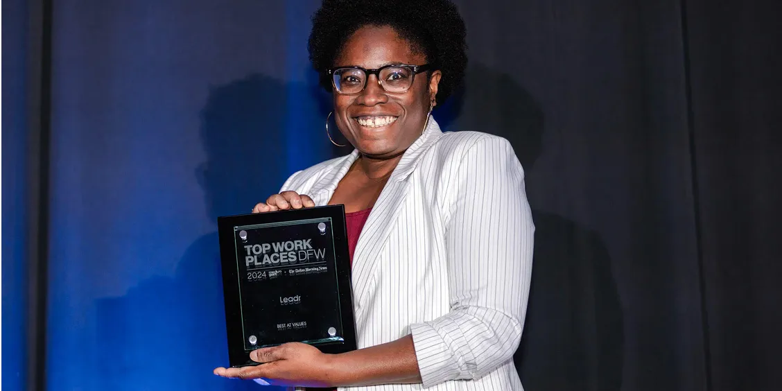Woman with earned award 2024 Top Places to Work in Dallas by The Dallas Morning News