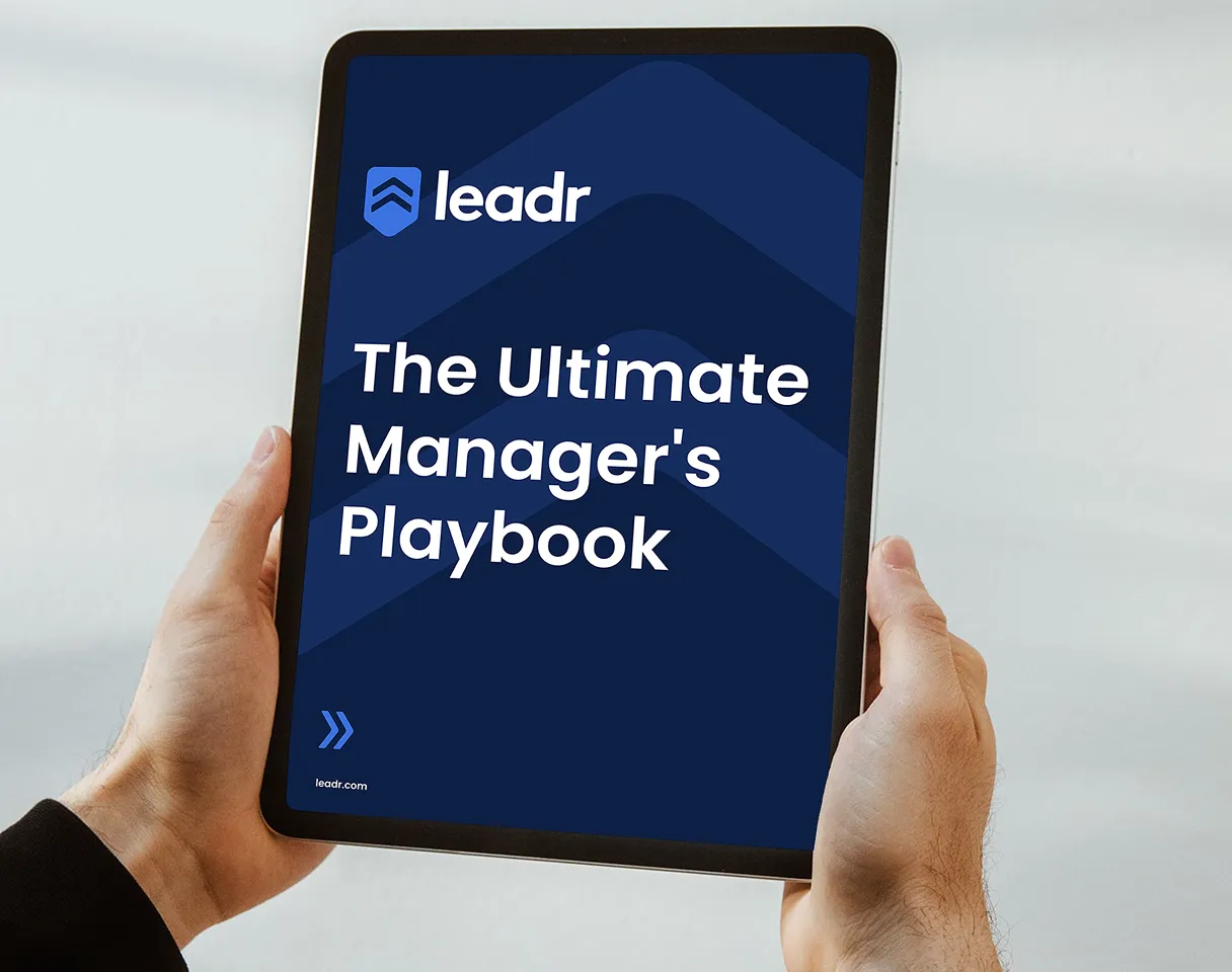 Tablet screen showing Leadr branding and "The Ultimate Manager's Playbook" title.