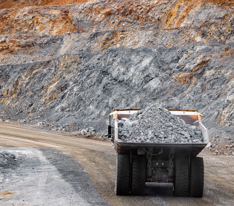 White emergency services vehicle with amber warning lights in winter weather in San Diego County, California