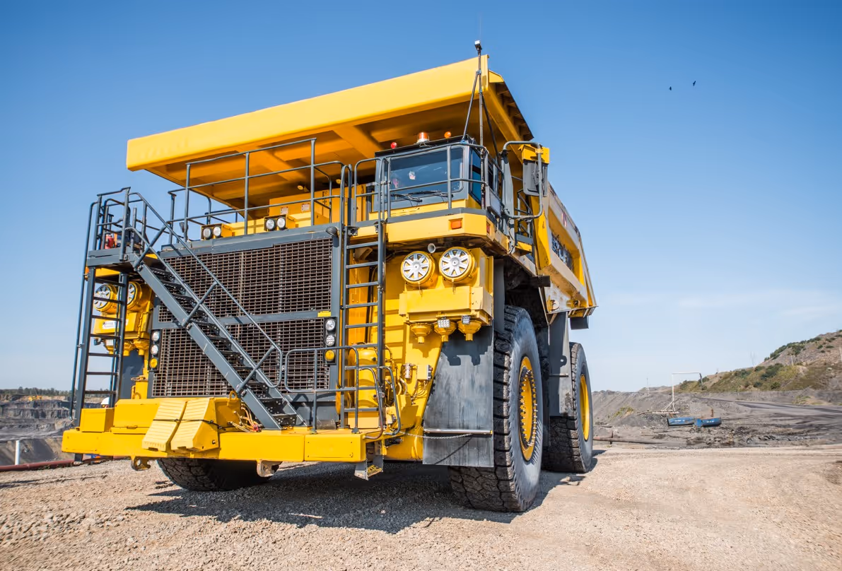 Yellow dump truck ready for excavation support and bulk material transport operations