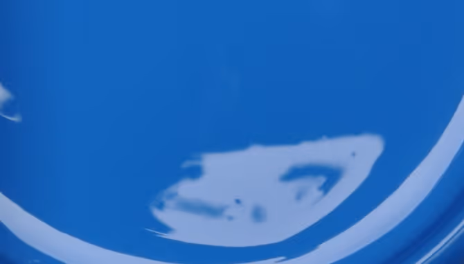 Blue industrial paint liquid for bulk coating and chemical transport trucking services