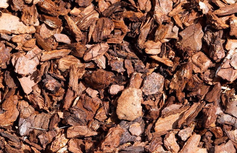 Brown bark mulch chips for commercial landscaping bulk delivery and hauling services