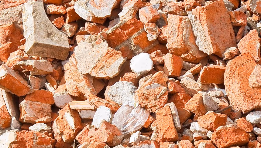 Broken brick and concrete rubble for construction demolition waste removal and hauling