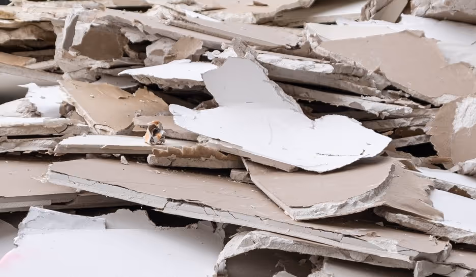 Broken drywall gypsum board debris for construction demolition waste removal and recycling