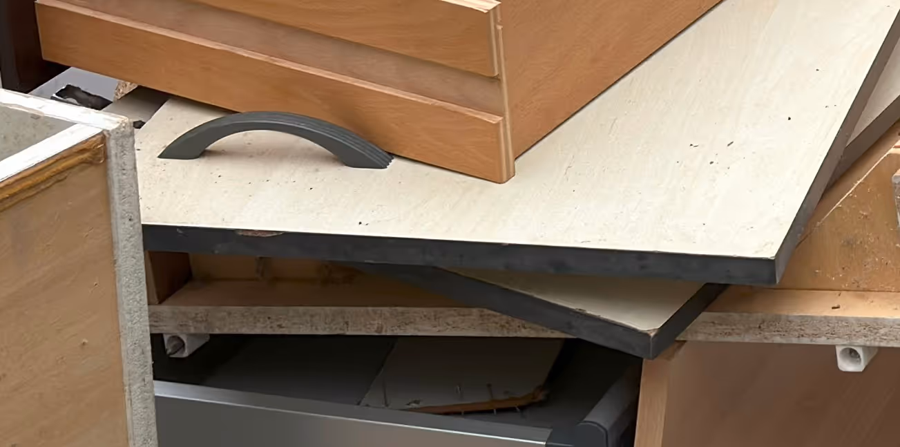 Old cabinet doors and millwork for renovation debris removal and recycling transport services