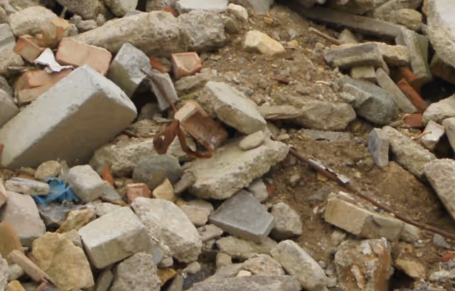 Mixed concrete, brick and construction debris from critical facility requiring commercial emergency hauling services