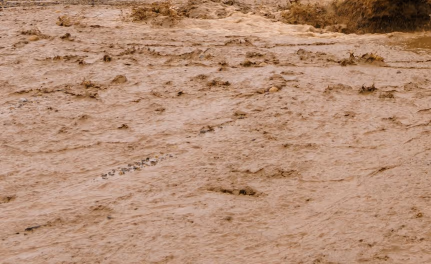 Mining tailings and waste sediment requiring specialized excavation support and environmental management for mine cleanup