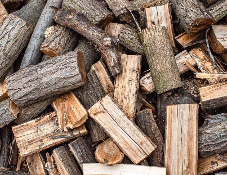Split firewood logs and cordwood for heating requiring forestry product transport and bulk wood delivery